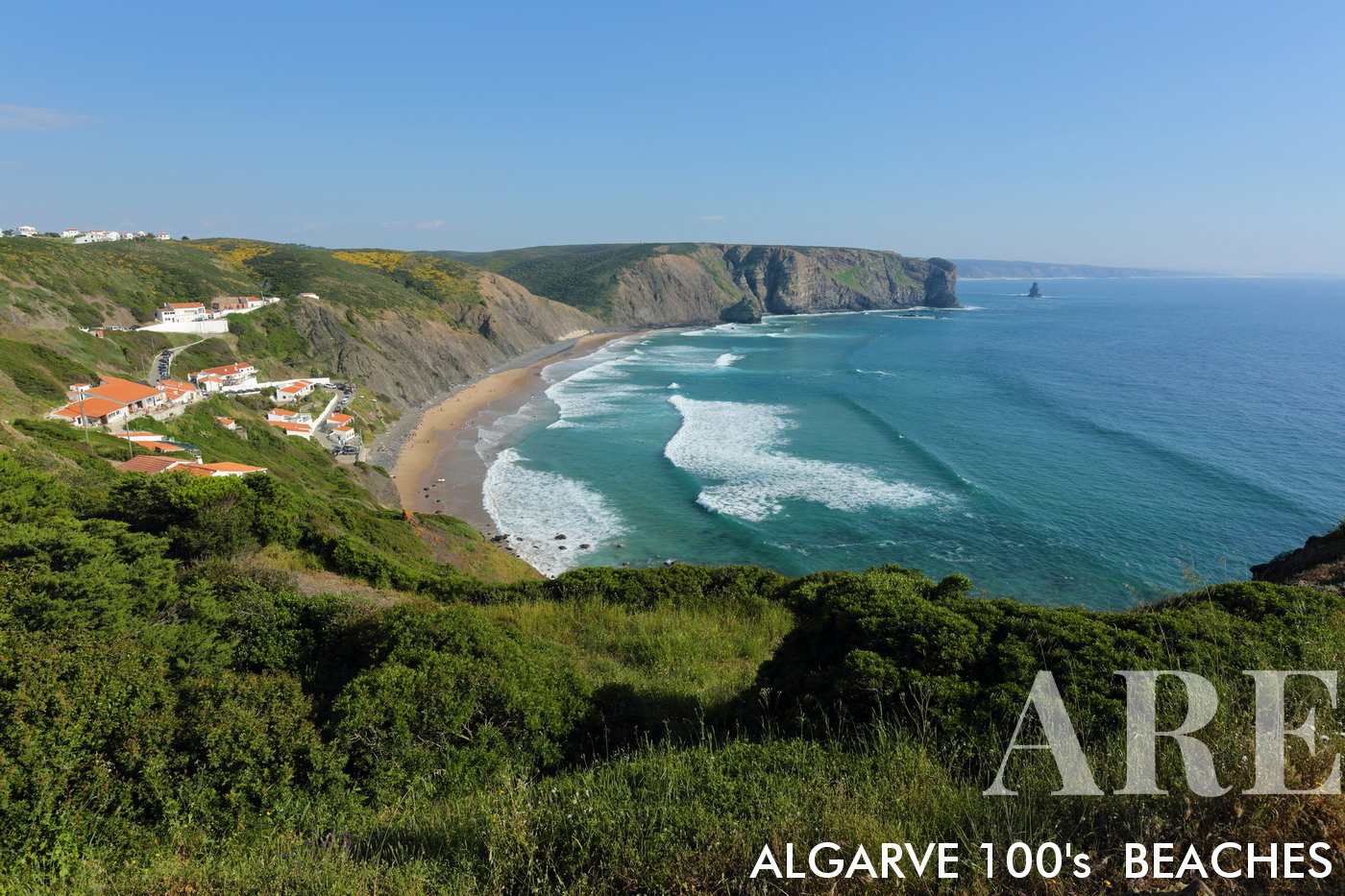 In the South-West Alentejo and Costa Vicentina Natural Park, Portugal, Arrifana Beach emerges as a popular surf spot. A north to south view from atop the cliffs unveils the beauty of this natural setting.