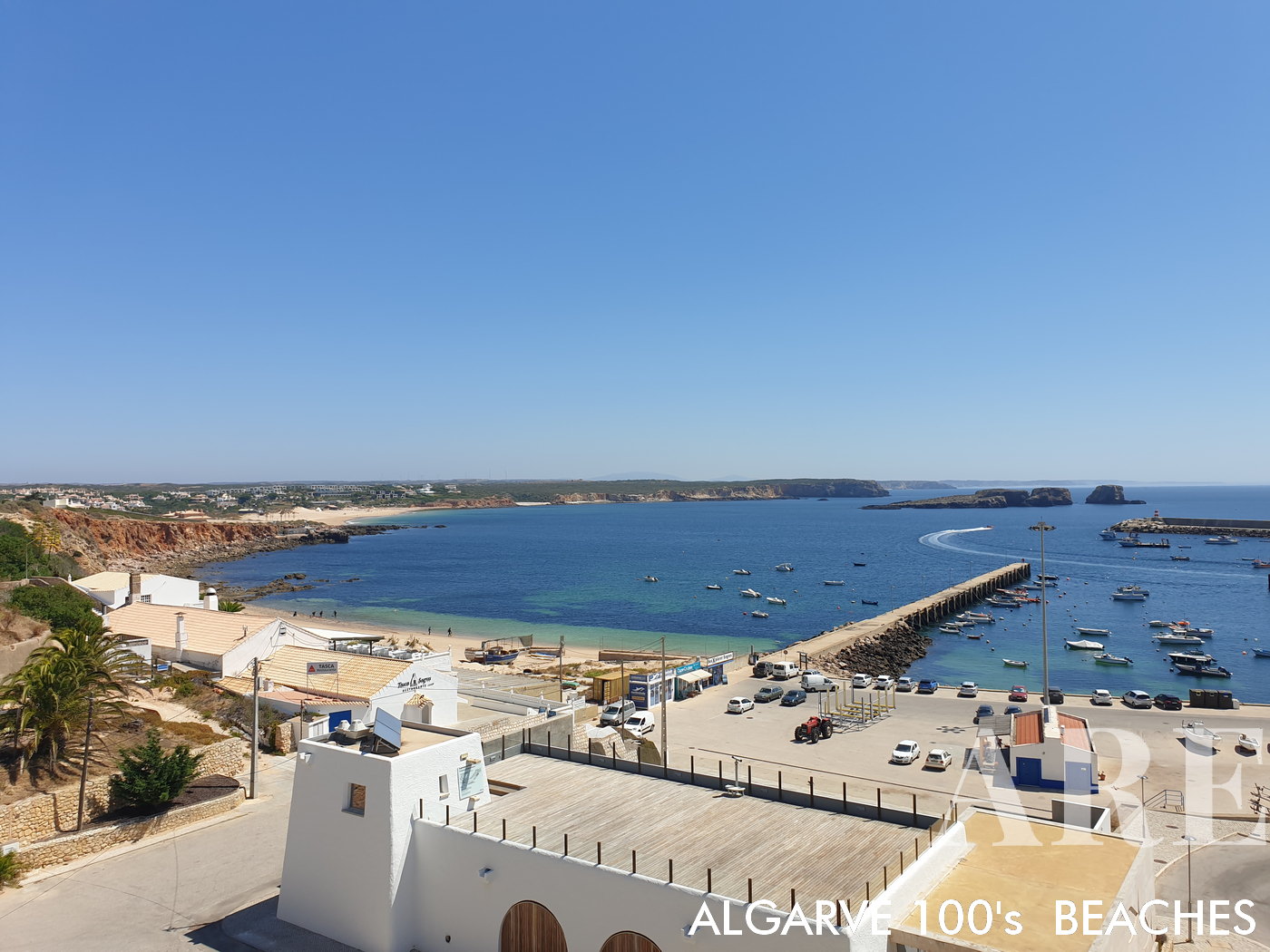 The serene vista encompassing Balleira in Sagres, with the majestic Martinhal Beach tracing the distant horizon.