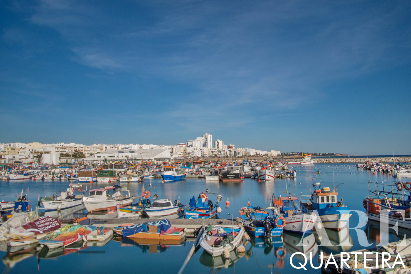 Fishing Boats at Quarteira Port, City Skyline in the Background