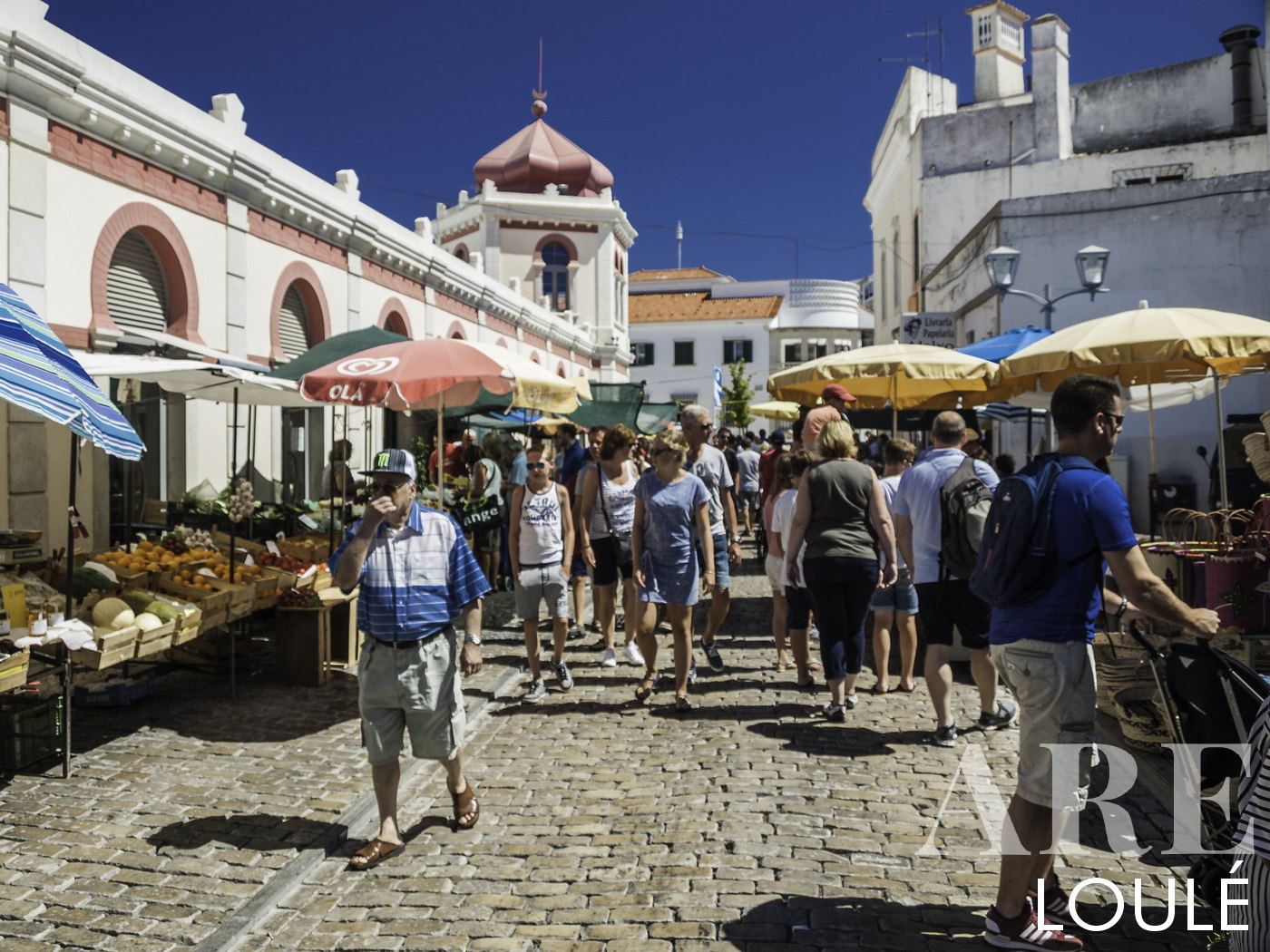 Tourists in loule on traditional market Street